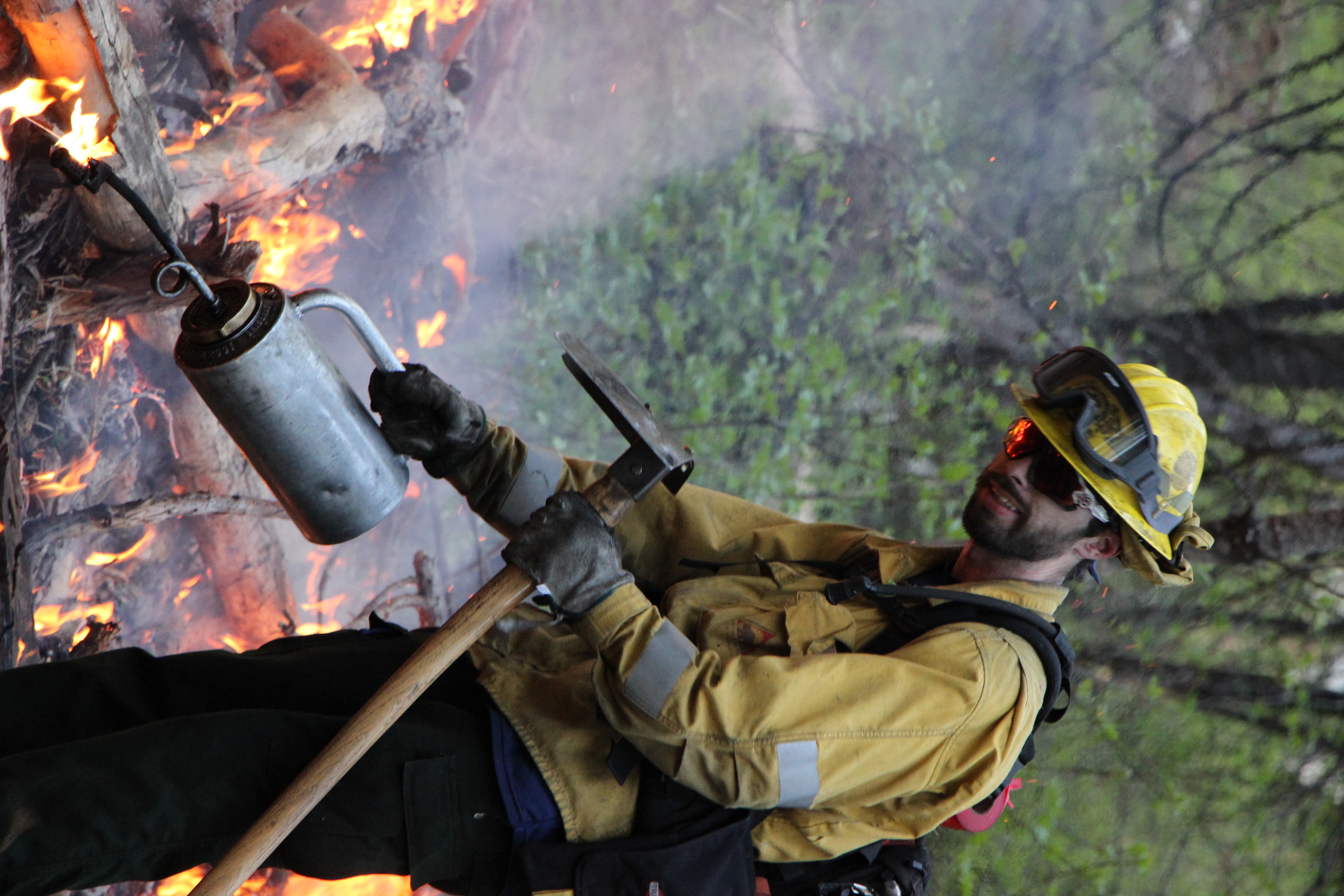 Ignitions crew member with drip torch 
